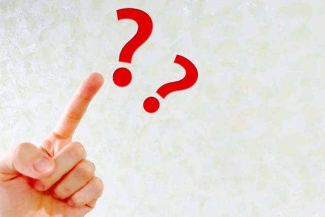 赤いクエスチョンマーク・人さし指